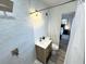 Modern bathroom features stylish vanity, shower with rainfall showerhead, and bedroom views at 2326 S Peninsula Dr, Daytona Beach, FL 32118