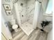 Updated bathroom features a walk-in shower, marble tile, and modern fixtures at 2326 S Peninsula Dr, Daytona Beach, FL 32118