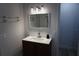 Modern bathroom features a stylish vanity with updated fixtures and a mirrored medicine cabinet at 2326 S Peninsula Dr, Daytona Beach, FL 32118