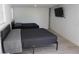 Spacious bedroom with modern decor, two beds, a mounted TV, and ample natural light at 2326 S Peninsula Dr, Daytona Beach, FL 32118