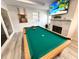 Spacious game room featuring a pool table, fireplace and flat screen television at 2326 S Peninsula Dr, Daytona Beach, FL 32118