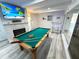 Bright game room with pool table, flat screen television, fireplace and bar area at 2326 S Peninsula Dr, Daytona Beach, FL 32118