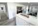 Hallway view leading to the open living space with modern finishes and ample natural light at 2326 S Peninsula Dr, Daytona Beach, FL 32118