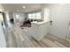 Open-concept living room featuring hardwood floors, natural light, and stylish decor, a welcoming and bright space at 2326 S Peninsula Dr, Daytona Beach, FL 32118