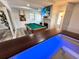 Spacious recreation room with a pool table, fireplace, and television, perfect for entertainment at 2326 S Peninsula Dr, Daytona Beach, FL 32118