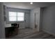 Versatile room with a table, chairs, door to bathroom, and neutral decor at 2326 S Peninsula Dr, Daytona Beach, FL 32118