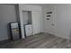 Modern room features mini-fridge, sink, closet, and wood-look floors at 2326 S Peninsula Dr, Daytona Beach, FL 32118