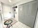 Bright entryway featuring tile floors, coat closet, and convenient in-unit laundry area at 2560 Woodgate Blvd # 203, Orlando, FL 32822