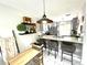 Modern kitchen featuring stylish countertops, stainless appliances, and a breakfast bar area at 2560 Woodgate Blvd # 203, Orlando, FL 32822