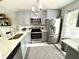 Modern kitchen with stainless steel appliances and ample counter space provides a sleek and functional area at 2560 Woodgate Blvd # 203, Orlando, FL 32822