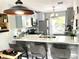 Modern kitchen with breakfast bar, updated countertops, and stainless steel appliances at 2560 Woodgate Blvd # 203, Orlando, FL 32822