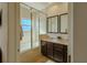 Bathroom featuring double vanity and frameless glass shower at 2652 Corvette Ln, Kissimmee, FL 34746