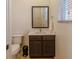 Compact bathroom featuring modern fixtures, a vanity, and a toilet at 2652 Corvette Ln, Kissimmee, FL 34746
