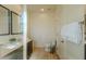 Well-lit bathroom features a modern vanity, toilet, and convenient towel rack at 2652 Corvette Ln, Kissimmee, FL 34746