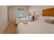 Bright bedroom with two beds, a nightstand, and a window view at 2652 Corvette Ln, Kissimmee, FL 34746