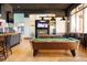 The game room has pool tables and TVs for entertainment and relaxation at 2652 Corvette Ln, Kissimmee, FL 34746