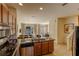 Well-lit kitchen featuring stainless steel appliances, breakfast bar, and easy access to outdoor patio at 2652 Corvette Ln, Kissimmee, FL 34746