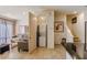 Cozy living room featuring neutral tones, tile flooring, and a convenient laundry closet at 2652 Corvette Ln, Kissimmee, FL 34746