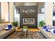 Elegant lobby area with modern fireplace feature, seating, and serene decor at 2652 Corvette Ln, Kissimmee, FL 34746