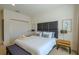 Well-appointed main bedroom with a king-size bed, plush headboard, and ambient lighting at 2652 Corvette Ln, Kissimmee, FL 34746