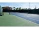 Well-maintained tennis court with blue and green surface and a surrounding fence for added privacy at 2652 Corvette Ln, Kissimmee, FL 34746