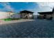 Expansive backyard featuring a custom pavilion, outdoor kitchen, and privacy fence, perfect for entertaining at 2822 Moultrie Creek Dr, Kissimmee, FL 34743