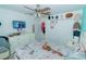 Bright bedroom with a ceiling fan, a large dresser, and closet with sliding doors at 2822 Moultrie Creek Dr, Kissimmee, FL 34743