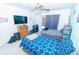 Cozy bedroom with ceiling fan, featuring a comfortable bed and a functional desk area at 2822 Moultrie Creek Dr, Kissimmee, FL 34743