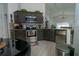 Modern kitchen features stainless steel appliances, granite counter tops, and plenty of cabinet storage at 2822 Moultrie Creek Dr, Kissimmee, FL 34743