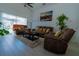 Cozy living room with comfortable seating, large windows, and a neutral color palette at 2822 Moultrie Creek Dr, Kissimmee, FL 34743