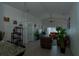 Open-concept living room with tile floors, ceiling fan, and glass sliding doors for ample natural light at 2822 Moultrie Creek Dr, Kissimmee, FL 34743