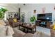 Comfortable living room featuring tile floors, ceiling fan, and a view to the kitchen at 2822 Moultrie Creek Dr, Kissimmee, FL 34743