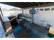 Outdoor bar area with a granite countertop, sink, and bar seating, ideal for entertaining at 2822 Moultrie Creek Dr, Kissimmee, FL 34743