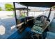 Well-equipped outdoor kitchen, with built-in grill and counter seating, perfect for entertaining on the paved patio at 2822 Moultrie Creek Dr, Kissimmee, FL 34743