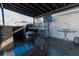 A fully-equipped outdoor kitchen with granite countertop, grill, sink, and seating, great for hosting gatherings at 2822 Moultrie Creek Dr, Kissimmee, FL 34743
