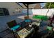 Outdoor seating area under a covered deck on stone patio, perfect for relaxing at 2822 Moultrie Creek Dr, Kissimmee, FL 34743