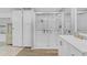 Bright bathroom featuring a glass door shower and a white cabinet and sink at 3139 Morning Light Way, Kissimmee, FL 34744