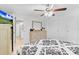Bedroom featuring light-colored furniture, a ceiling fan, and ample closet space at 3139 Morning Light Way, Kissimmee, FL 34744