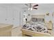 Bedroom featuring light-colored furniture, a ceiling fan, and ample closet space at 3139 Morning Light Way, Kissimmee, FL 34744