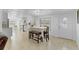 Dining area boasts a table with seating, complemented by ample natural light at 3139 Morning Light Way, Kissimmee, FL 34744