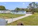 Single story home with long driveway, healthy green lawn and other well maintained homes nearby at 3139 Morning Light Way, Kissimmee, FL 34744