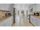 Bright kitchen with stainless steel appliances, ample counter space, and adjacent dining area at 3139 Morning Light Way, Kissimmee, FL 34744