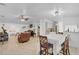 Open-concept living area with tile flooring seamlessly connecting to the dining space at 3139 Morning Light Way, Kissimmee, FL 34744