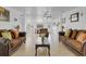 Spacious living room featuring tile floors, couches, and bright natural light at 3139 Morning Light Way, Kissimmee, FL 34744