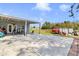 View of the home's back patio, furniture, and yard at 3139 Morning Light Way, Kissimmee, FL 34744