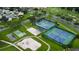 Aerial view of community tennis courts, playground and amenities at 3214 Candle Ridge Dr # 201, Orlando, FL 32822