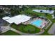 Aerial view showcases clubhouse, pool, and golf course views at 3214 Candle Ridge Dr # 201, Orlando, FL 32822