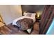 Bedroom with neutral tones, a comfortable bed, and ample closet space with laminate flooring at 3214 Candle Ridge Dr # 201, Orlando, FL 32822