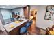 Updated kitchen features stainless appliances and a granite island with seating and bedroom view at 3214 Candle Ridge Dr # 201, Orlando, FL 32822