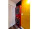 Laundry room features red washer and dryer combo at 3214 Candle Ridge Dr # 201, Orlando, FL 32822